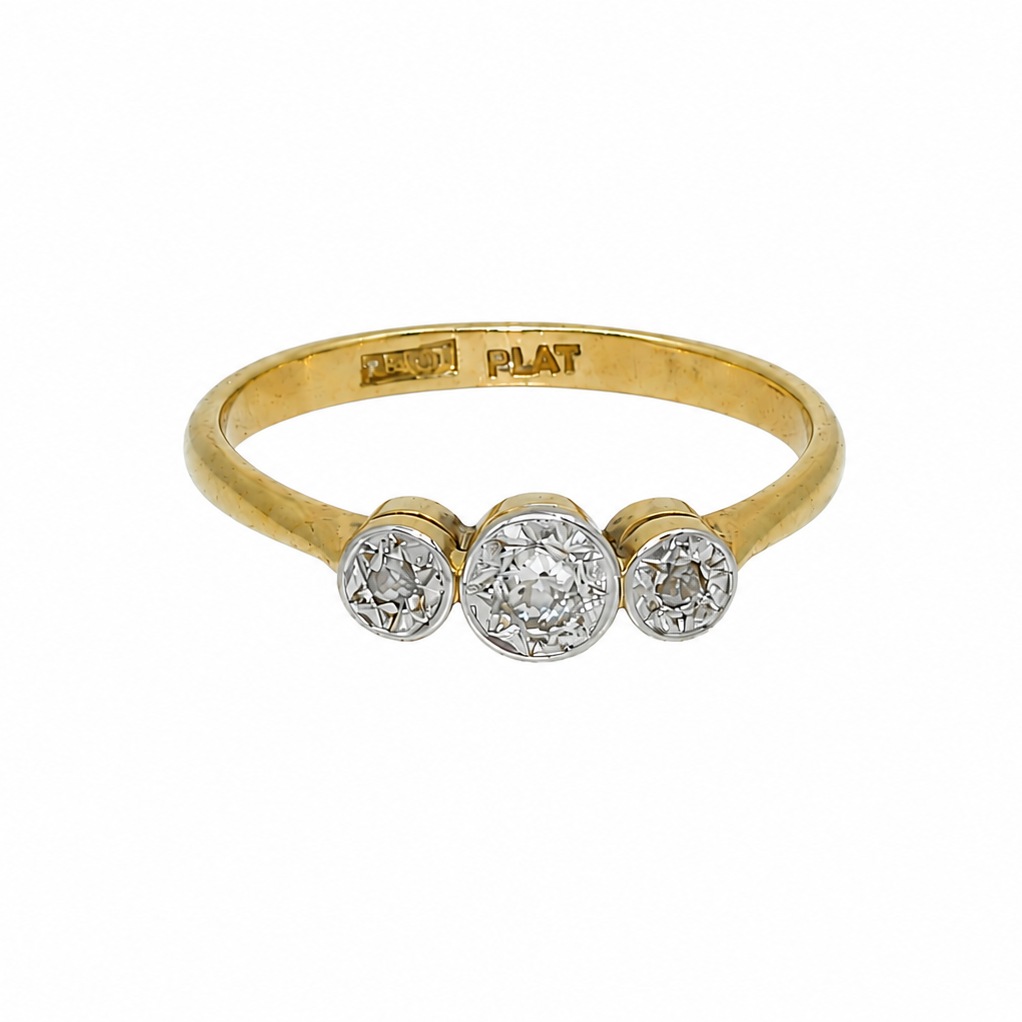A vintage diamond illusion set trilogy ring