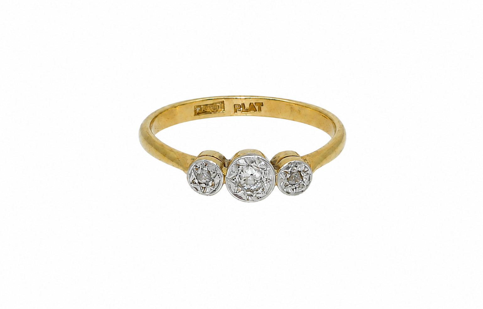 A vintage diamond illusion set trilogy ring