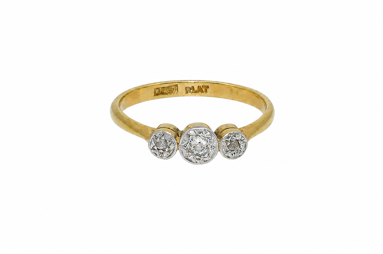 A vintage diamond illusion set trilogy ring