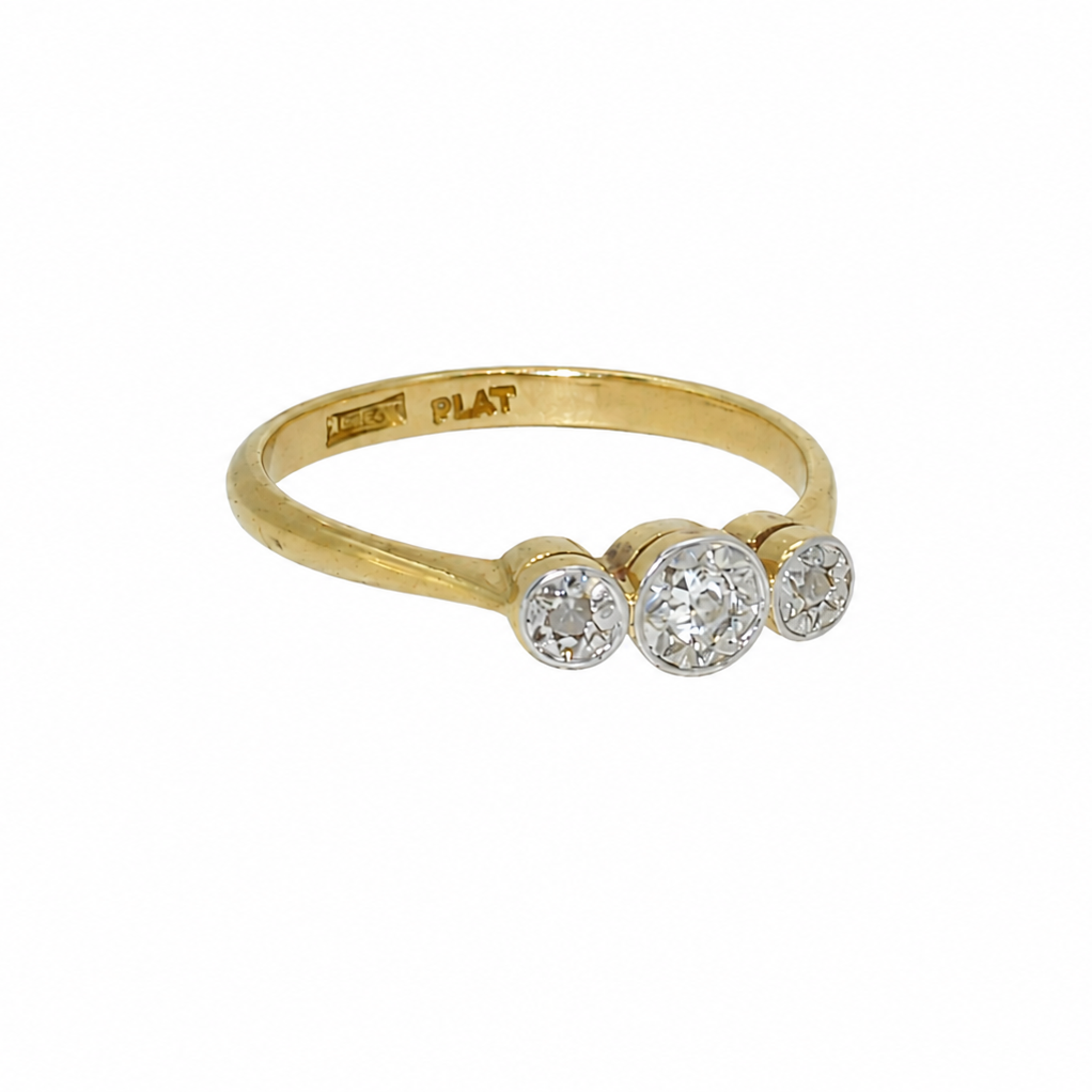 A vintage illusion set diamond three stone