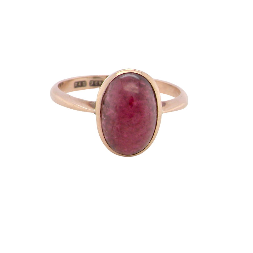 A vintage dress ring. Set with an oval cabouchon cut garnet, 11x7mm, i
