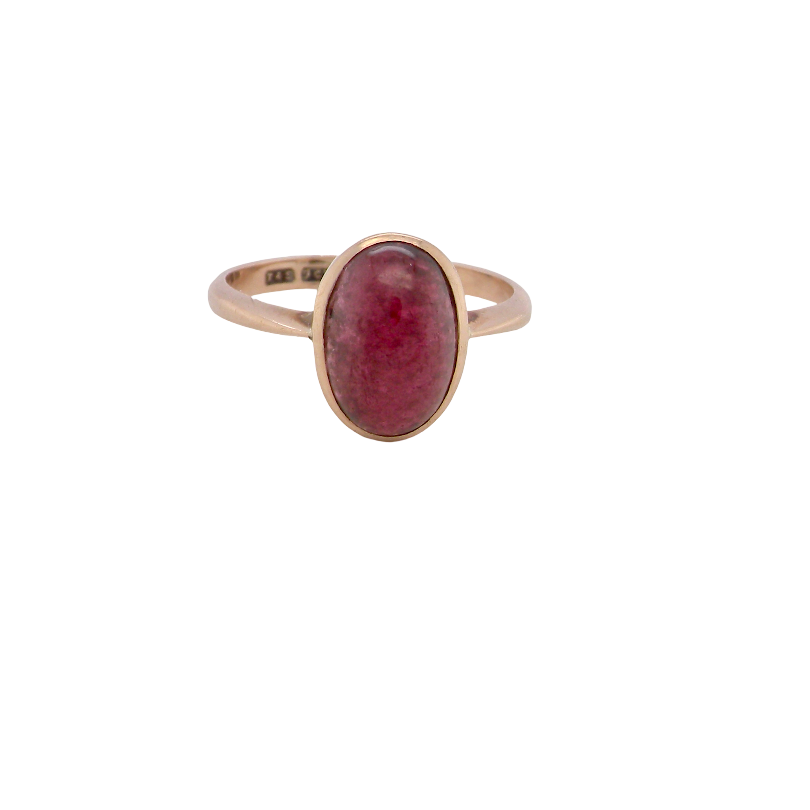 A vintage dress ring. Set with an oval cabouchon cut garnet, 11x7mm, in a rim style setting.