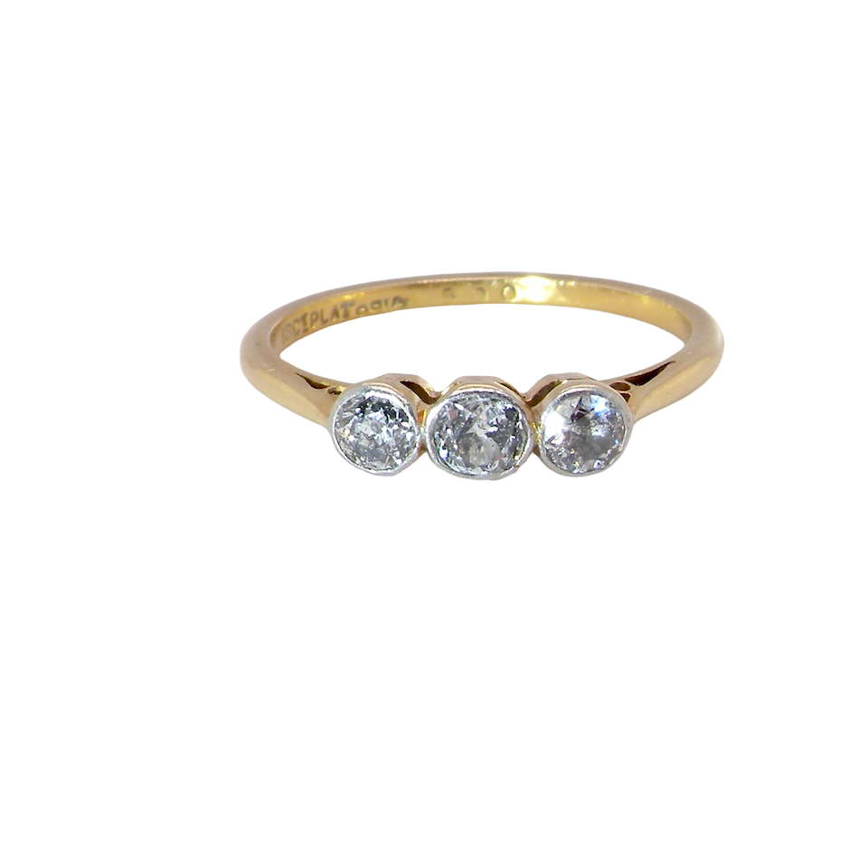 A vintage early 20th century trilogy ring. Set with three old cut diamonds, centre stone 3.8mm, and each side a 3.6mm diamond (total carat weight estimated at 0.55 carats)