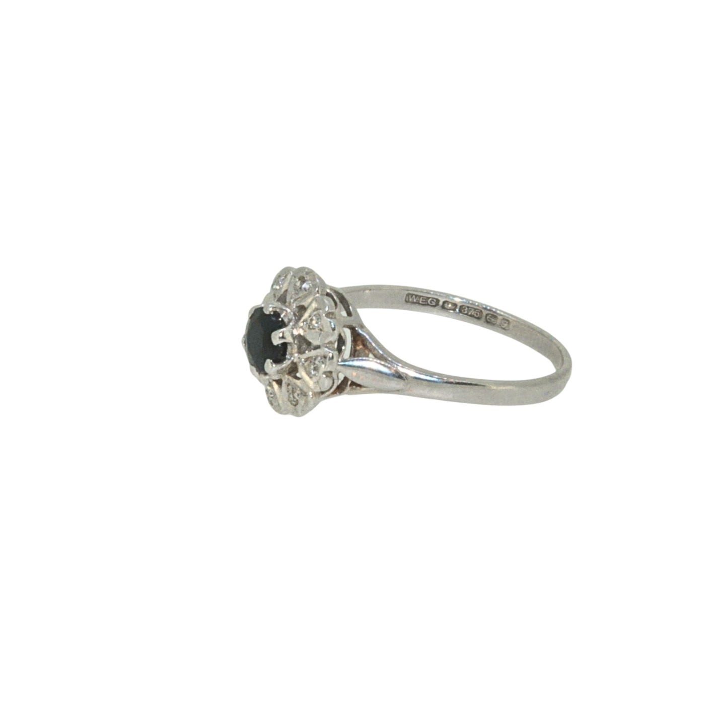 Hallmarked side view of sapphire and diamond cluster ring