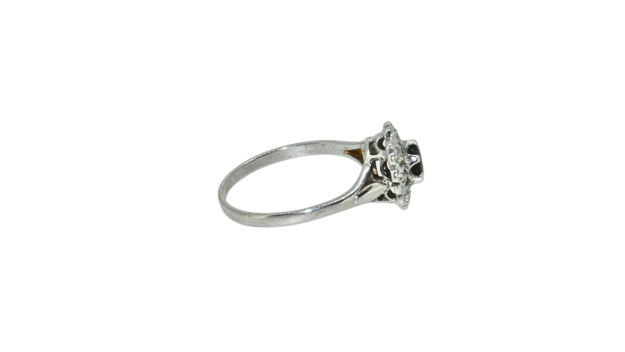 Side view of sapphire and diamond cluster ring