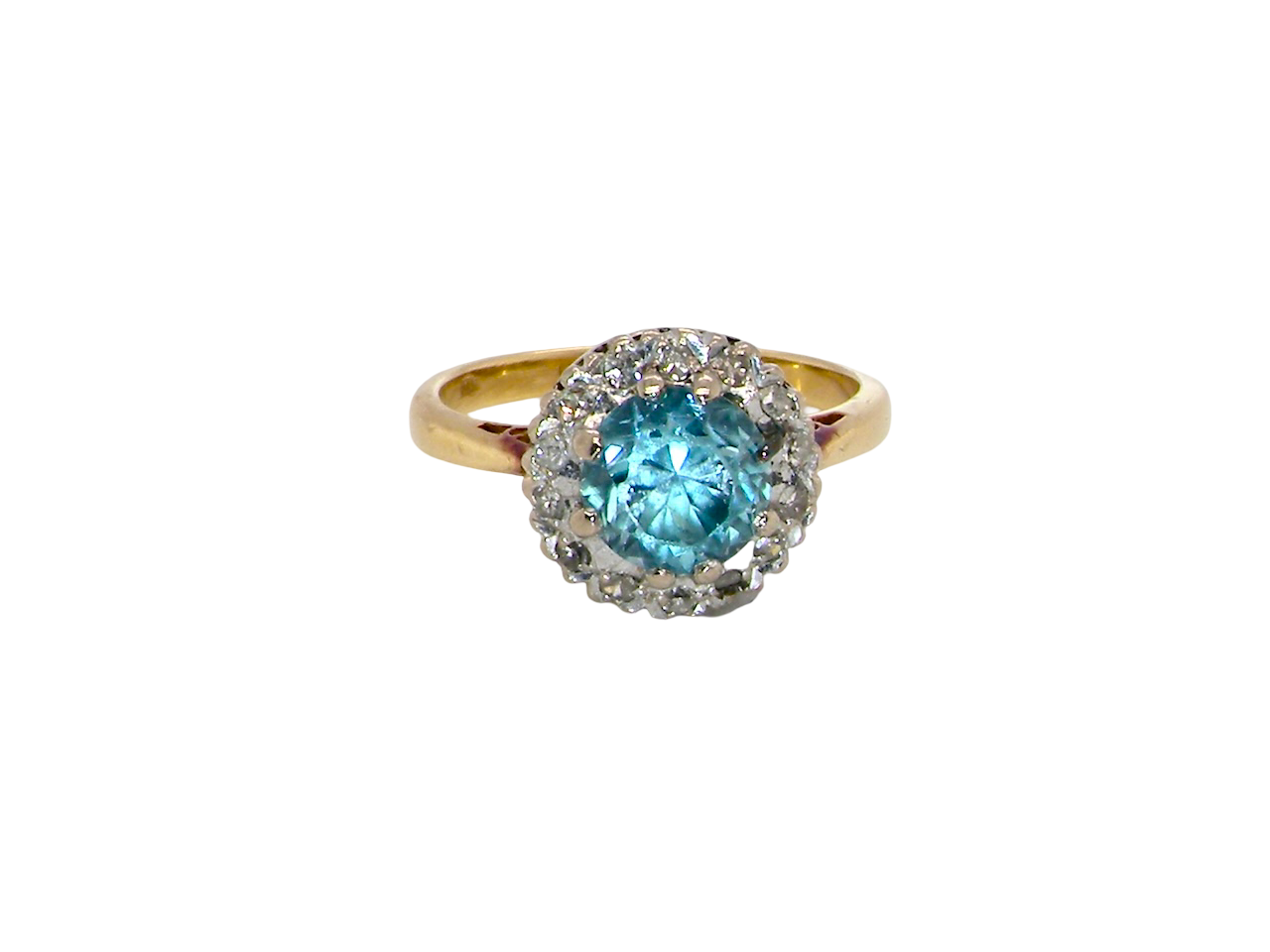 A vintage mid 20th century cluster ring.
Centre stone a blue zircon, 7mm diameter.