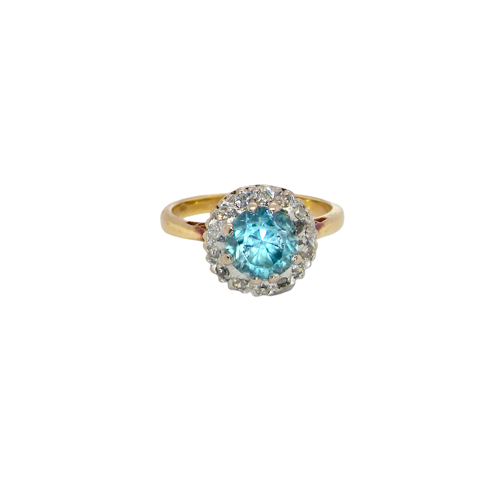 A vintage mid 20th century cluster ring.
Centre stone a natural blue zircon, 7mm diameter.