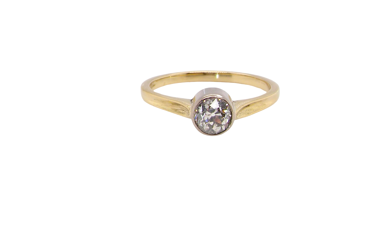 Gold ring with a diamond on a white background