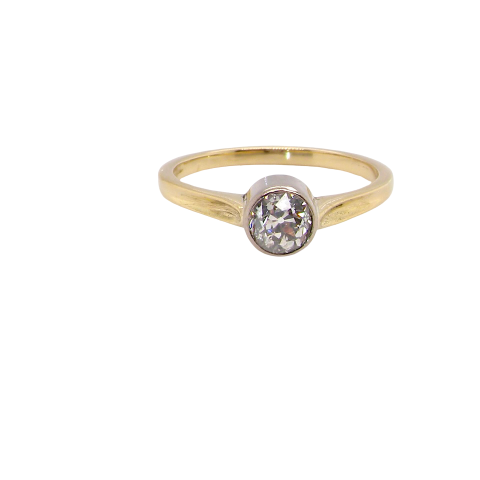Gold ring with a diamond on a white background