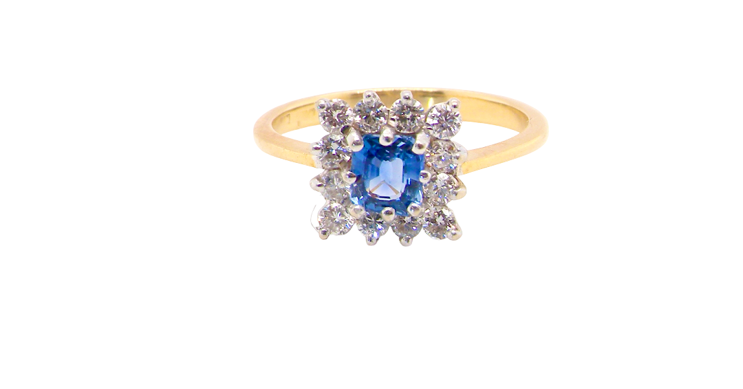 A vintage square cluster ring. Features to the centre a square sapphire 5x5mm (est 0.50 carats) mid blue- cornflower hue. 