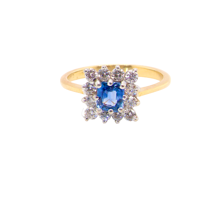 A vintage square cluster ring. Features to the centre a square sapphire 5x5mm (est 0.50 carats) mid blue- cornflower hue. 