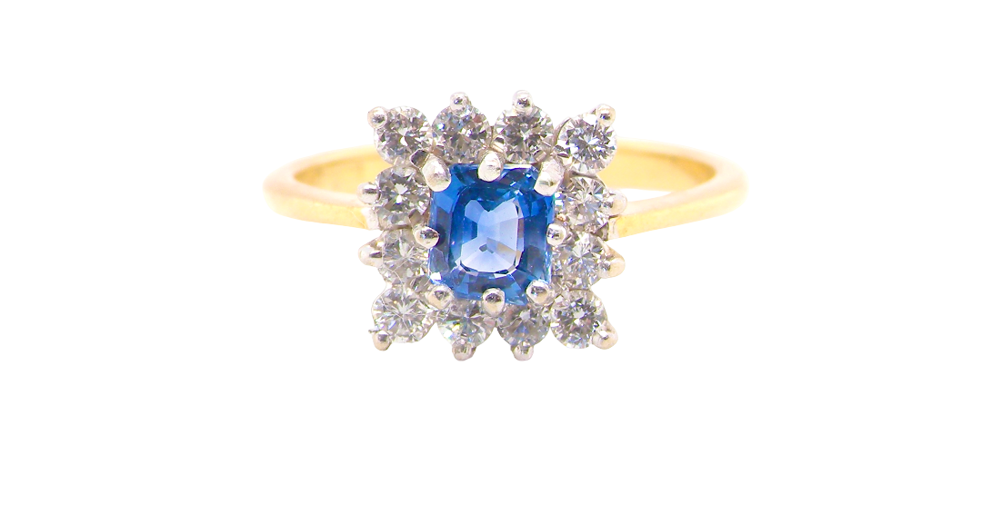 A vintage square cluster ring. Features to the centre a square sapphire 5x5mm (est 0.50 carats) mid blue-