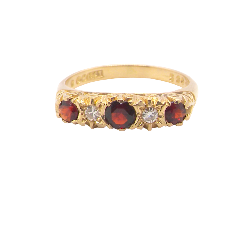 A vintage style 18 carat gold boat shaped ring. Features three dark red garnets, centre 4mm, each end a 3mm stone. 