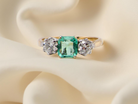 A vintage three stone Emerald and Diamond ring