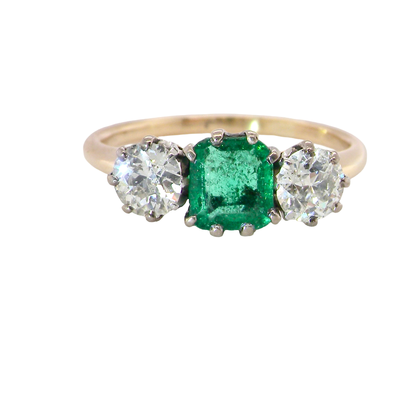A vintage trilogy ring. Centre stone a step