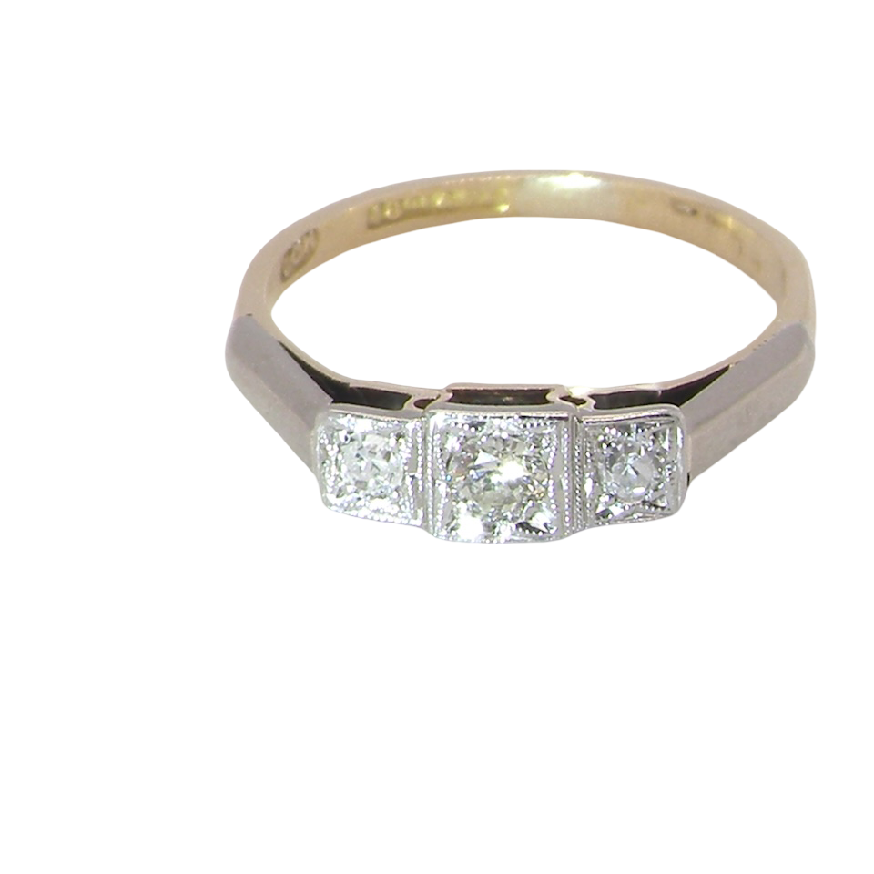A vintage trilogy ring. Set with three old brilliant cut white diamonds, centre 3mm and each side a 2.4mm diamond. Total estimated at 0.20 carats, colour H-j, clarity Si