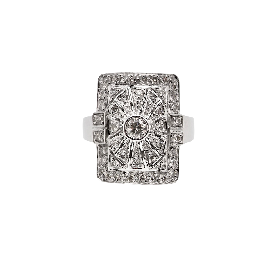 white gold ring with diamond accents on a white background