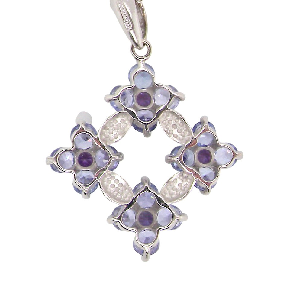 A white gold amethyst and tanzanite pendant