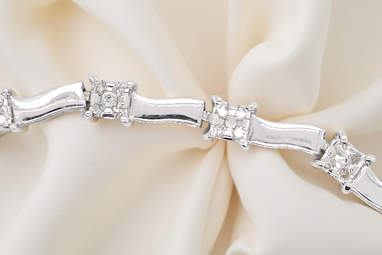 bracelet with diamond accents on a soft beige background