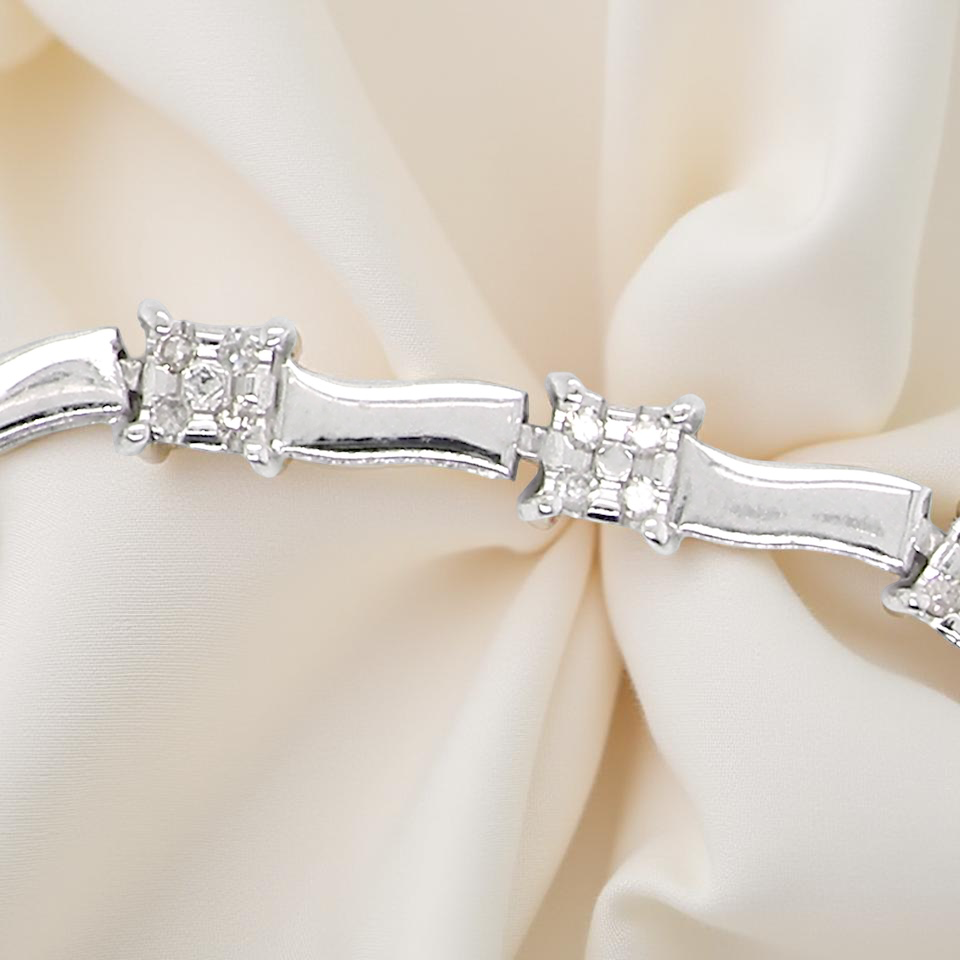 bracelet with diamond accents on a soft beige background
