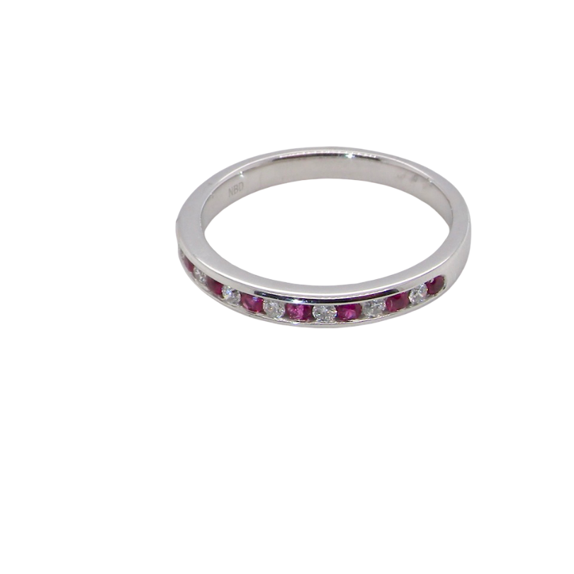 A white gold half hoop eternity ring. Set with seven round rubies and six brilliant cut white diamonds new