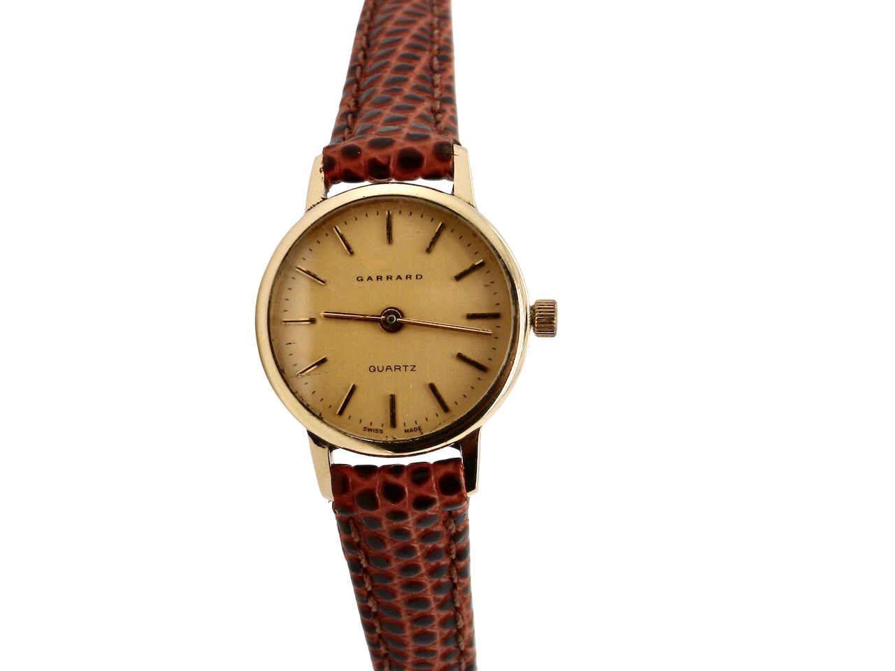 Wristwatch with brown leather strap and gold case on white background