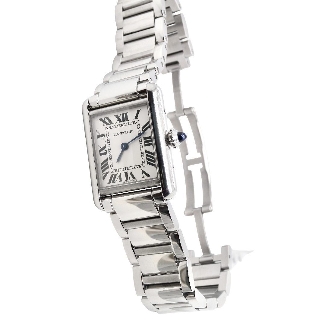 A womans stainless steel Cartier Tank Must wrist watch. Model number WSTA0051.
Silver coloured dial with Roman Numerals. Blue steeled hands. Case measures 29.5x22mm, case thickness 6.6mm. Quartz movement, synthetic sapphire button.