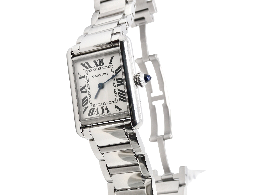 A womans stainless steel Cartier Tank Must wrist watch. Model number WSTA0051.
Silver coloured dial with Roman Numerals. Blue steeled hands. Case measures 29.5x22mm, case thickness 6.6mm. Quartz movement, synthetic sapphire button.