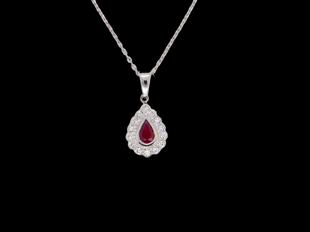 An 18 Carat White Gold Ruby and Diamond Pendant