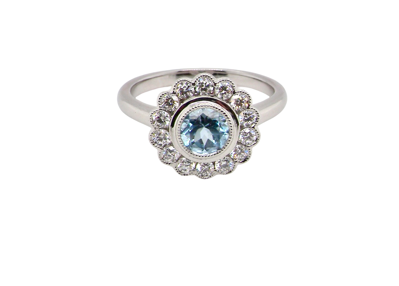 An 18 carat Gold Aquamarine & Diamond Cluster Ring