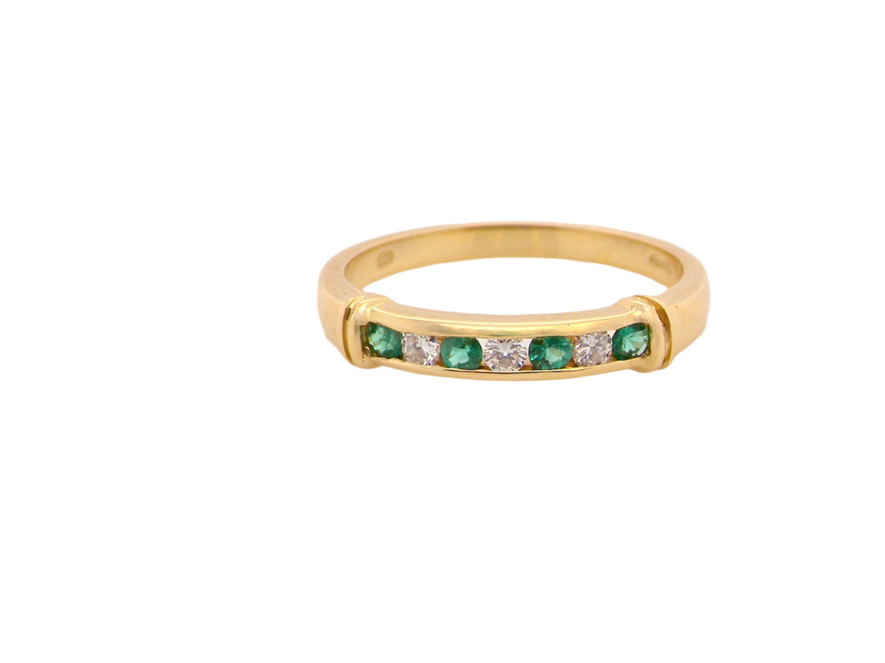 An 18 carat gold Emerald and Diamond Eternity ring