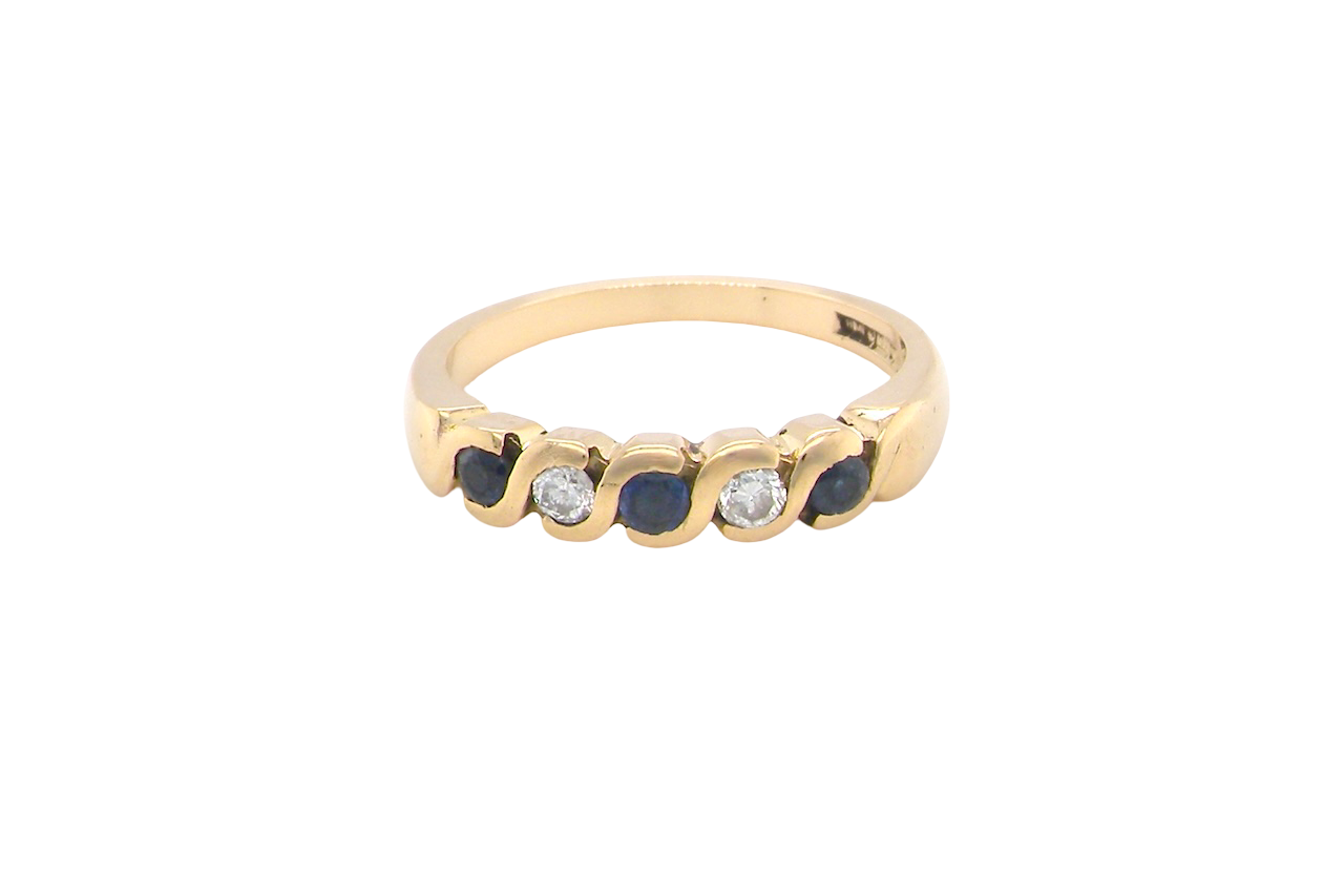 An 18 carat gold Sapphire and Diamond eternity ring