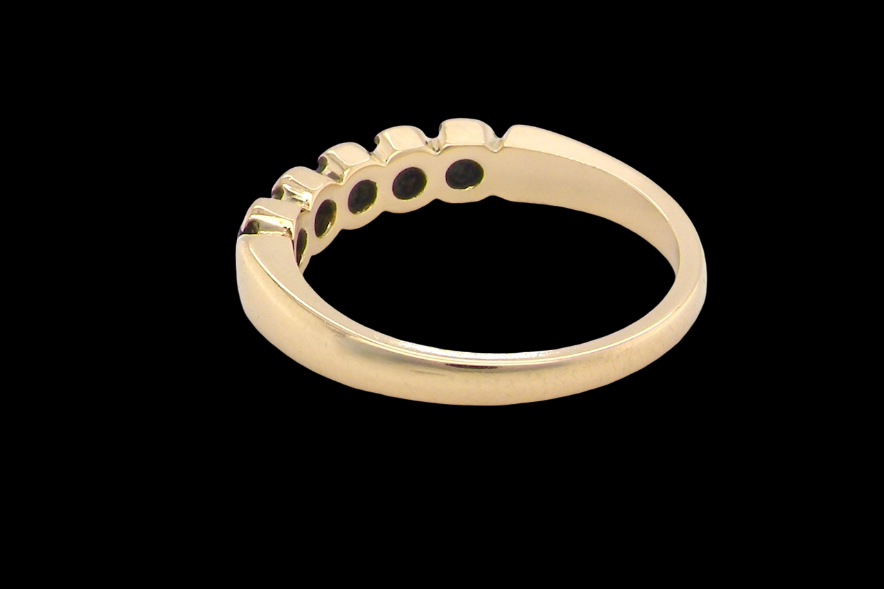 An 18 carat gold Sapphire and Diamond eternity ring