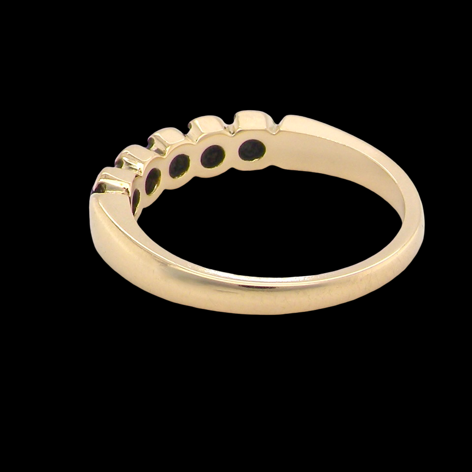 An 18 carat gold Sapphire and Diamond eternity ring