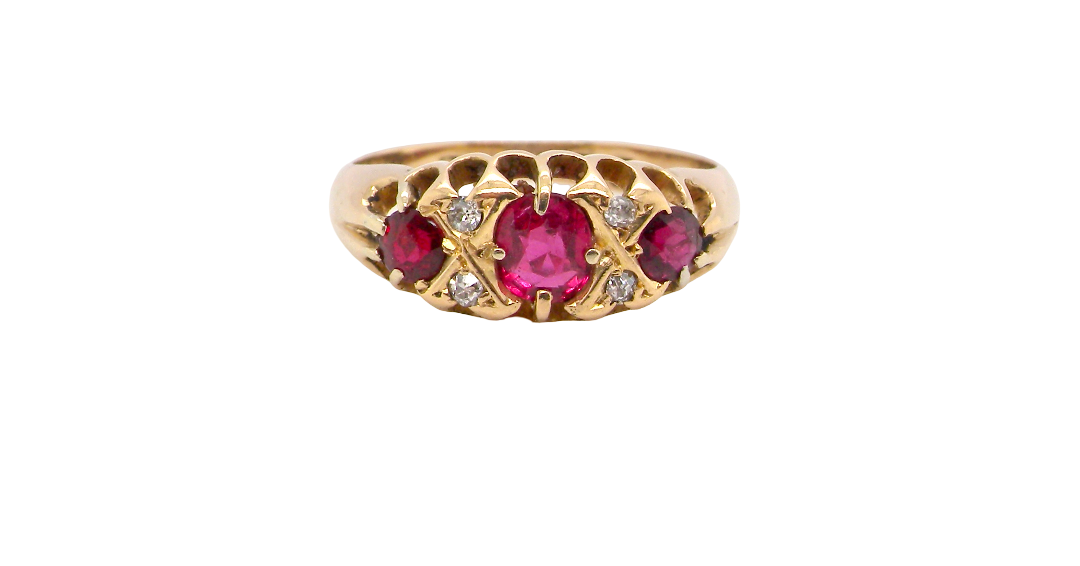 An 18 carat gold antique boat shaped ring. Features three lovely coloured wine red rubies, centre 5x4mm,