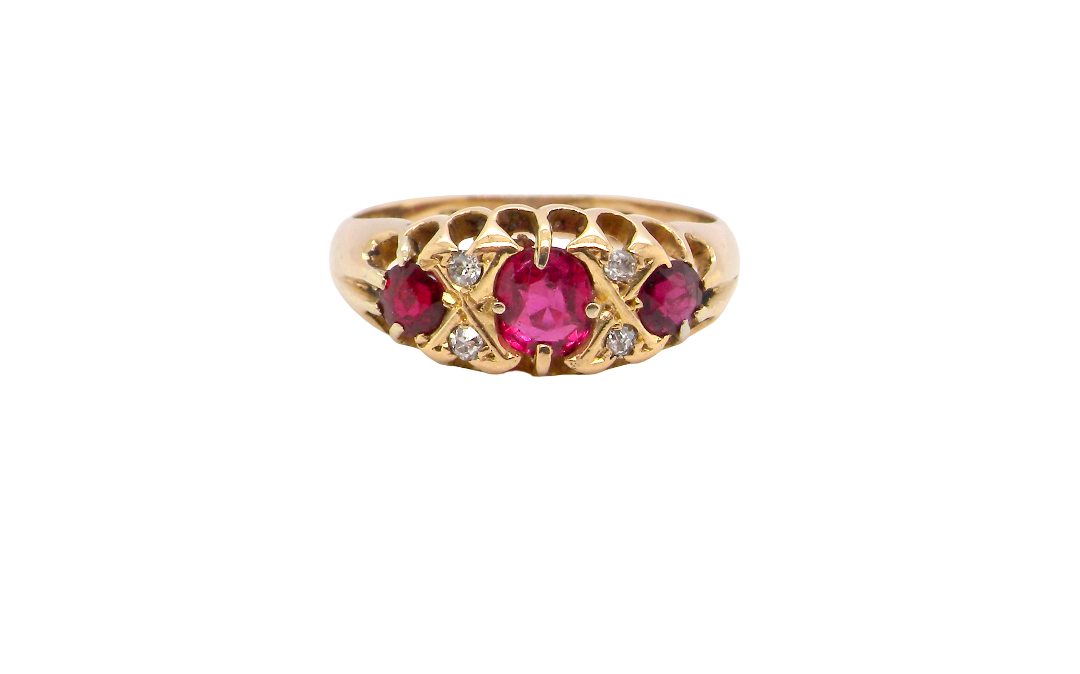 An 18 carat gold antique boat shaped ring. Features three lovely coloured wine red rubies, centre 5x4mm,