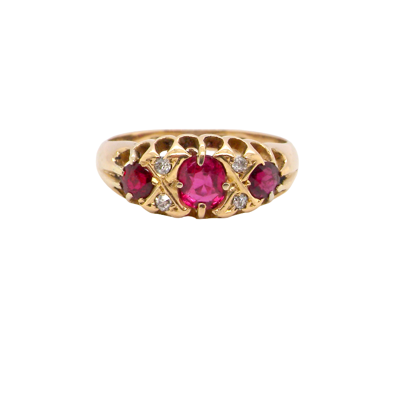 An 18 carat gold antique boat shaped ring. Features three lovely coloured wine red rubies, centre 5x4mm,
