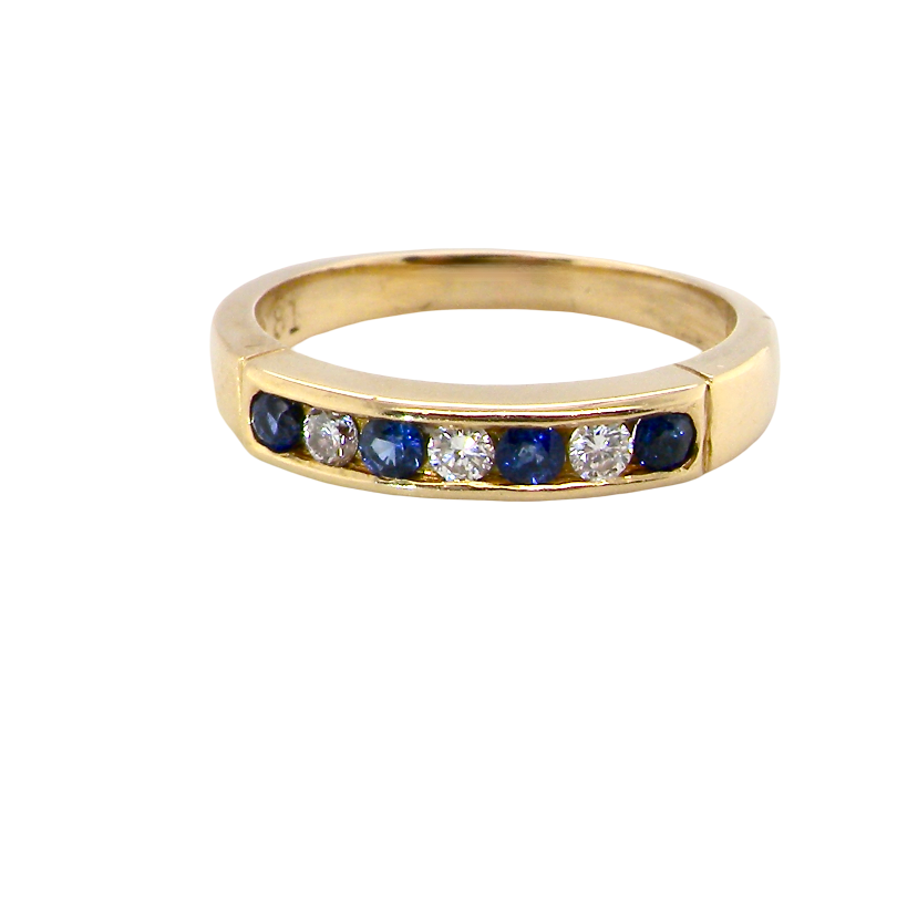 An 18 carat gold half hoop eternity ring.
Features four round sapphires , each 2.4mm,