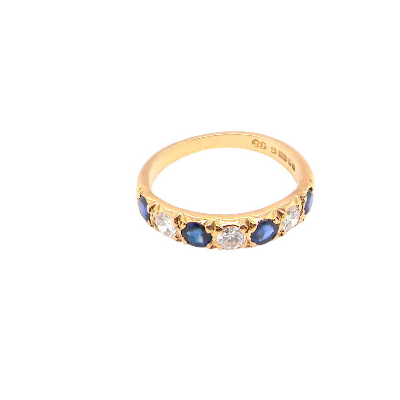 top An 18 carat gold half hoop eternity ring. Set with four sapphires each 3.4mm (0.15 carats) and three diamonds, brilliant cut, 3.4mm (0.15 carats).