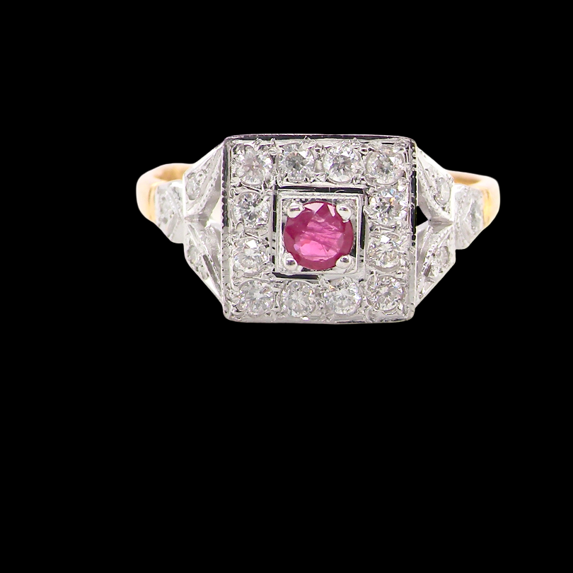 An 18 carat gold square cluster that features to the centre a round ruby and an outer halo diamonds.