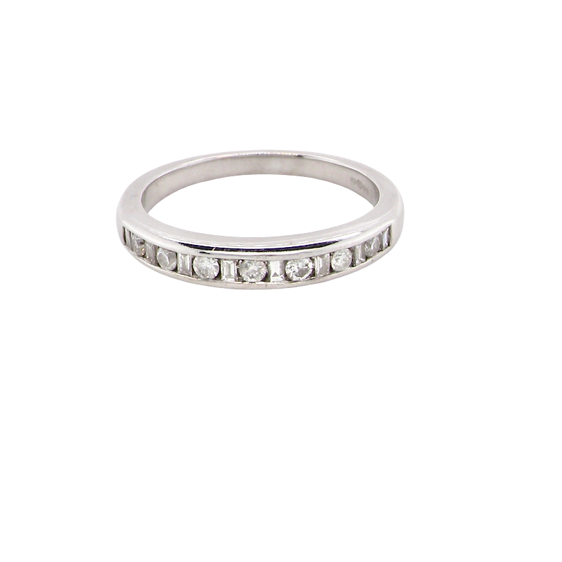 An 18 carat white gold half hoop eternity ring. Mixed cuts of white diamonds which consist of seven round brilliant stones, each 2mm diameter and eight baguette cut stones, each 2x1.5mm. Estimated total 0.50 carats.