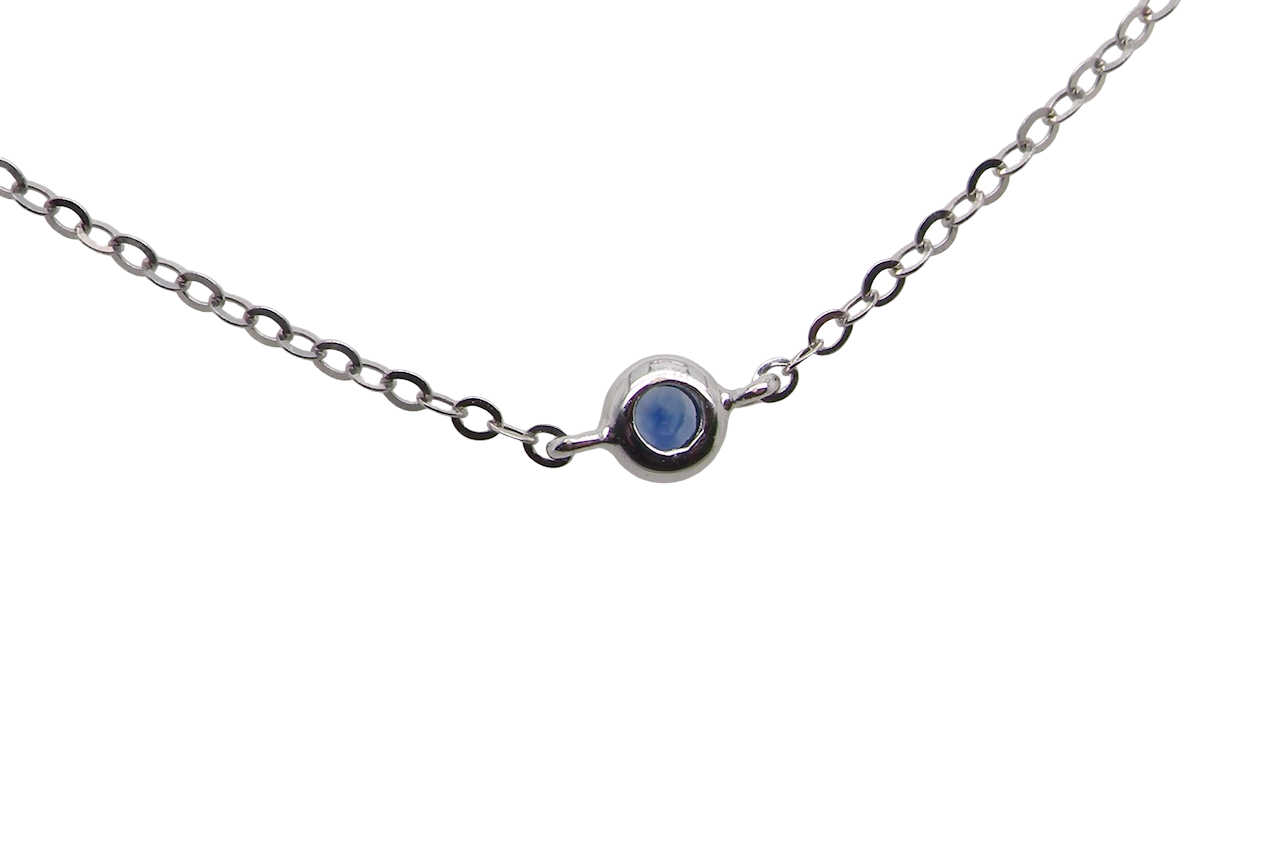 An 18 carat white gold necklace set with miniature sapphire