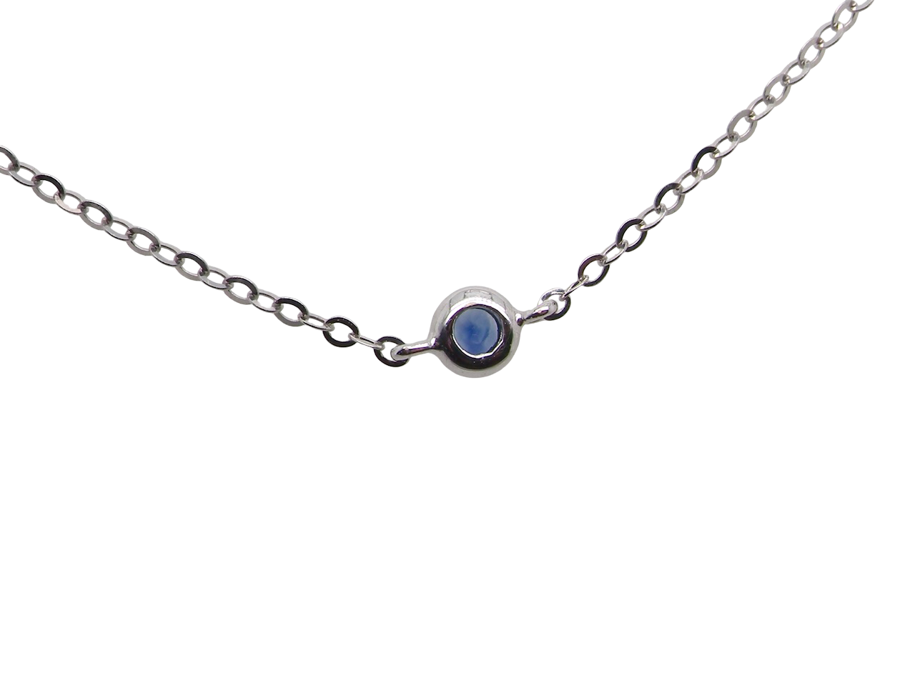 An 18 carat white gold necklace set with miniature sapphire