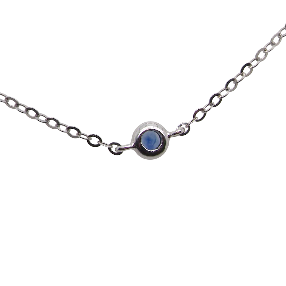 An 18 carat white gold necklace set with miniature sapphire