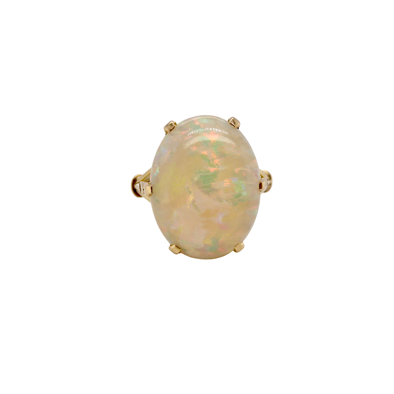 An 18 carat yellow gold* dress ring set with a large opal gemstone.