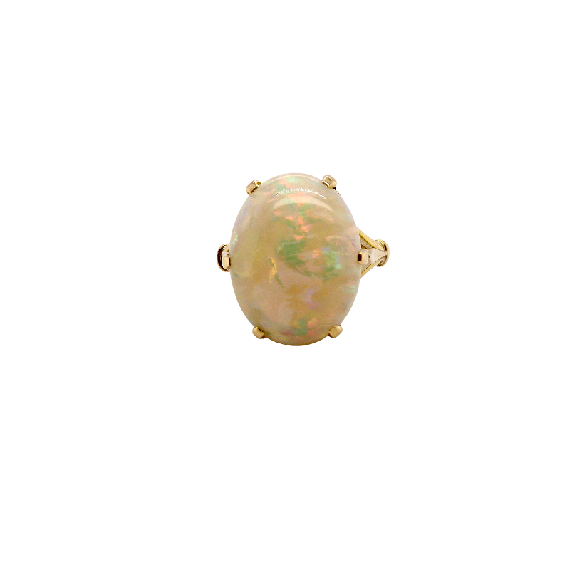 An 18 carat yellow gold* dress ring set with a large oval opal gemstone.