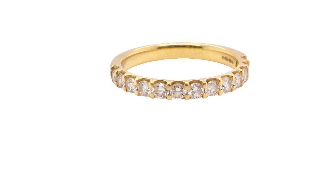 An 18 carat yellow gold half hoop diamond eternity ring originally purchased from Goldsmiths (original boxes supplied)