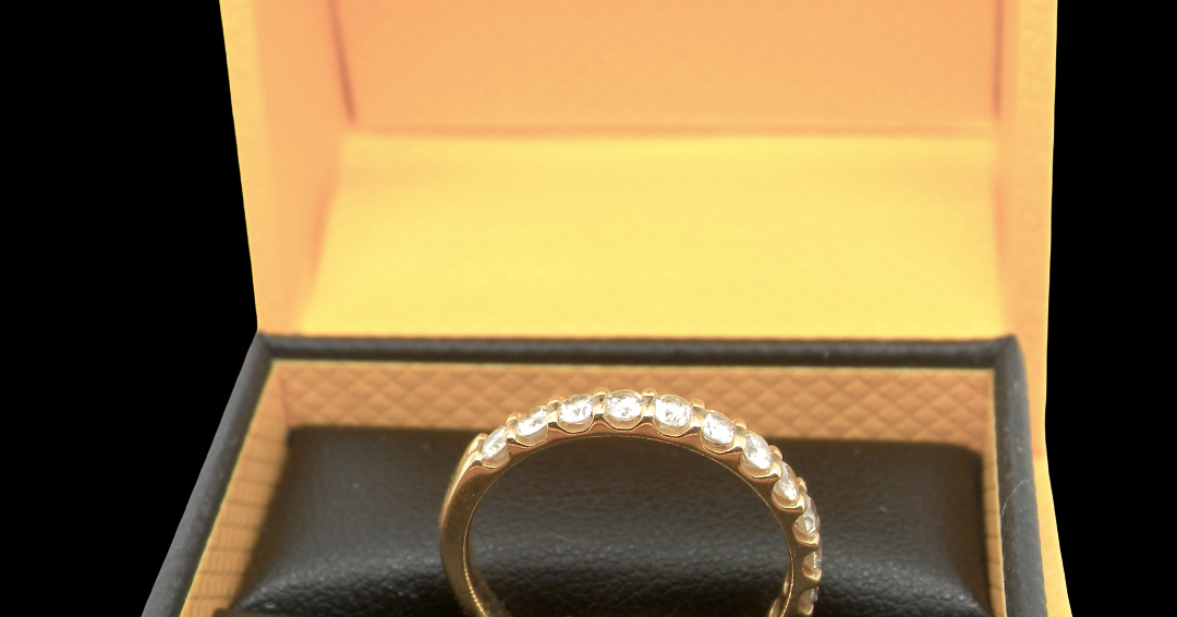 An 18 carat yellow gold half hoop diamond eternity ring originally purchased from Goldsmiths top view