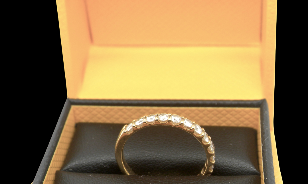 An 18 carat yellow gold half hoop diamond eternity ring originally purchased from Goldsmiths top view