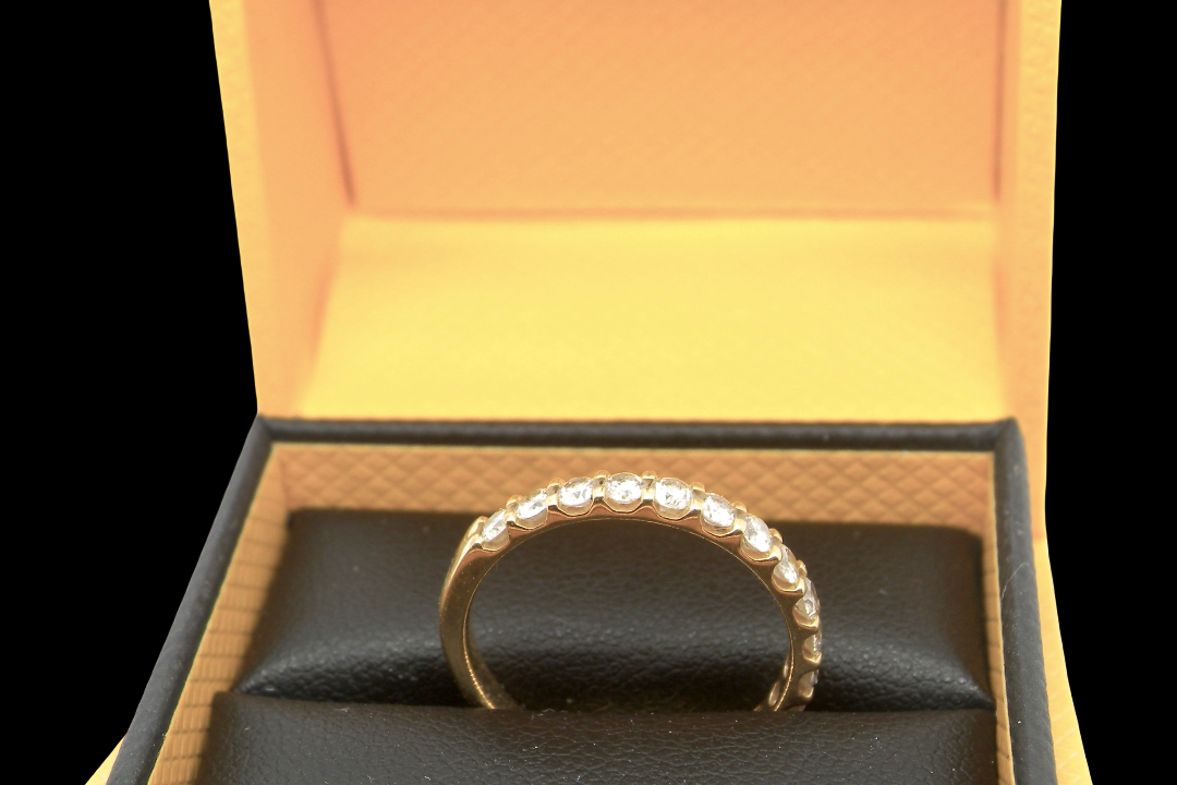 An 18 carat yellow gold half hoop diamond eternity ring originally purchased from Goldsmiths top view